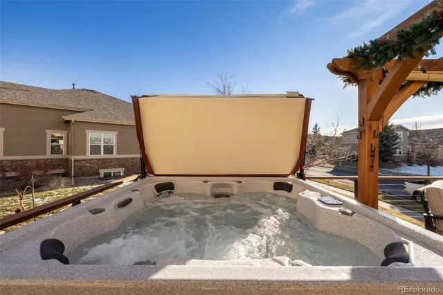 a view of a chairs and table in the balcony