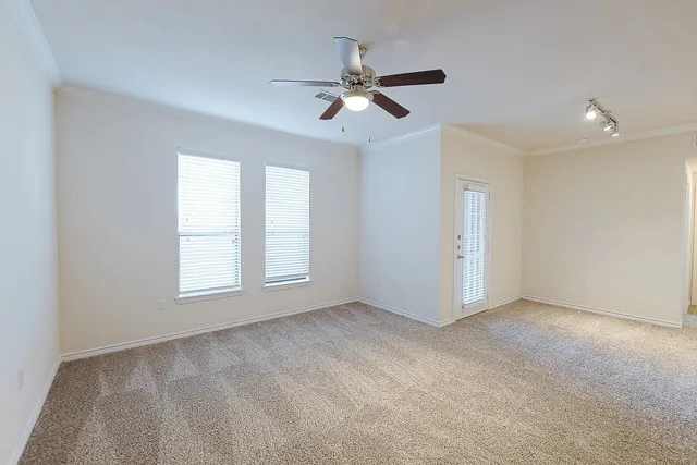 a view of an empty room with a window