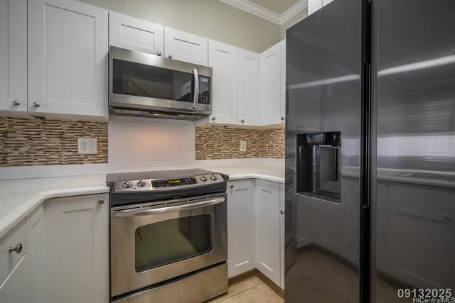 a kitchen with a stove and a microwave