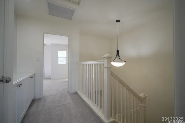 a view of a hallway with windows