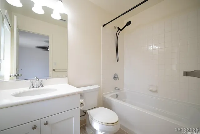 a bathroom with a sink toilet vanity and shower