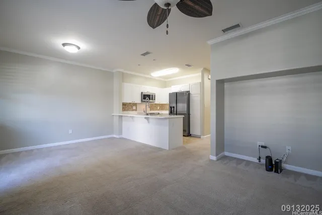 a view of a kitchen with a sink and cabinets