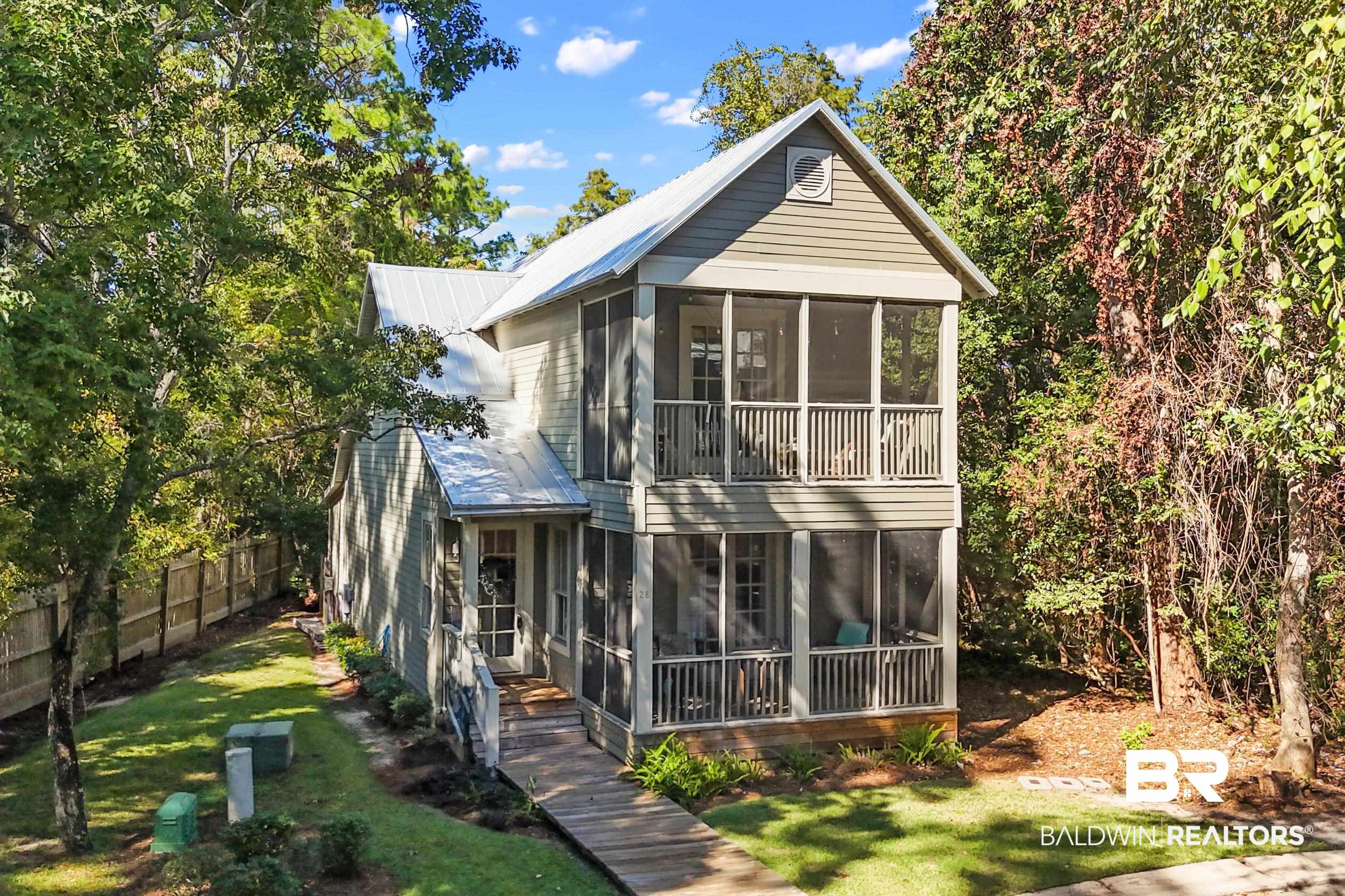 25773 Canal Road, Unit 28 Orange Beach, AL 36561 - Photo 1 of 48 Rear view of house featuring a sunroom