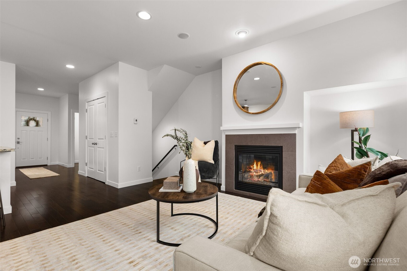 16516 2nd Park Southeast Bothell, WA 98012 - Photo 10 of 39 a living room with furniture a mirror and a fireplace