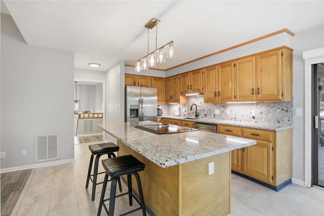 9 Tradewinds Way Salem, SC 29676 - Photo 11 of 45 This spacious kitchen offers ample countertop space and a functional layout for culinary creativity.