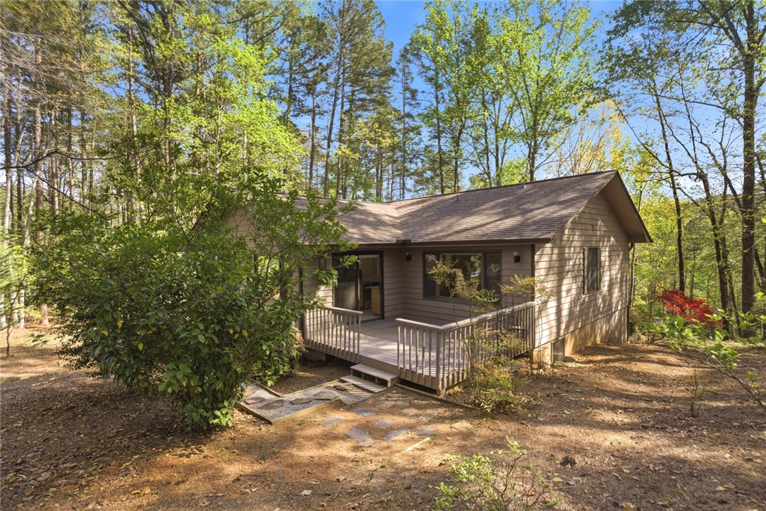 9 Tradewinds Way Salem, SC 29676 - Photo 34 of 45 This charming home features a lovely deck, perfect for outdoor living amidst a lush, wooded setting.