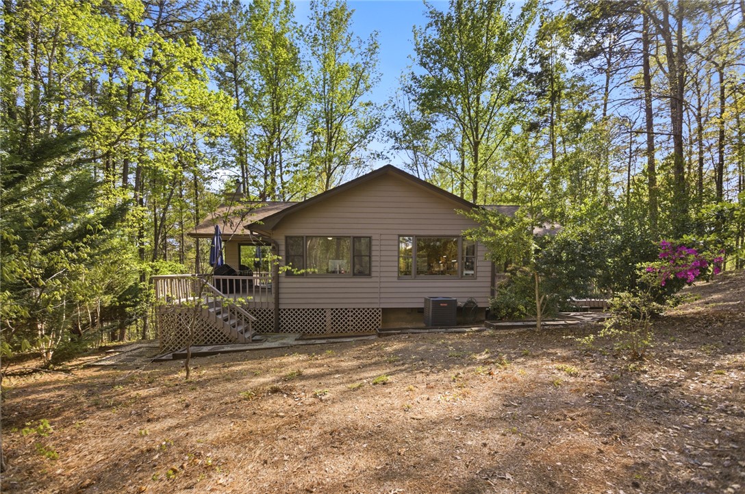 9 Tradewinds Way Salem, SC 29676 - Photo 35 of 45 This charming retreat, nestled amongst lush greenery, offers a private and serene living experience.