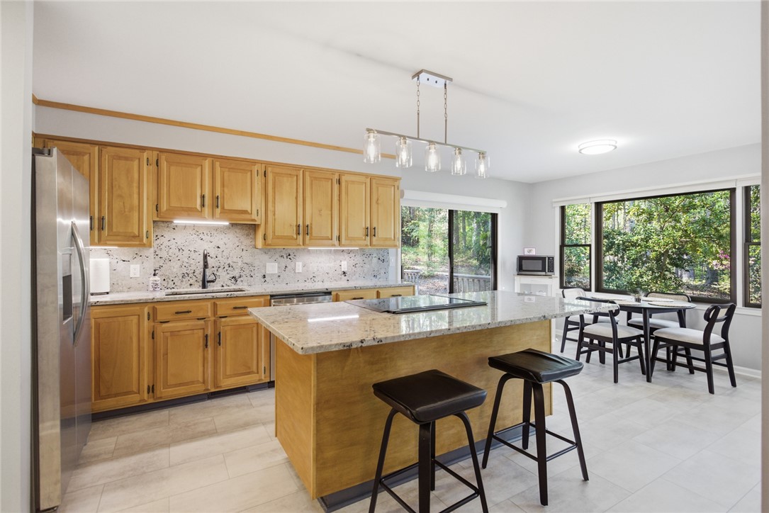 9 Tradewinds Way Salem, SC 29676 - Photo 10 of 45 This bright kitchen features ample counter space, modern appliances, and seamless outdoor access.