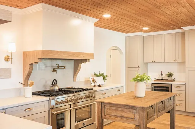a kitchen with a stove and a sink