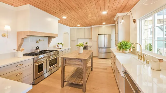 a view of a dining room with furniture and a window