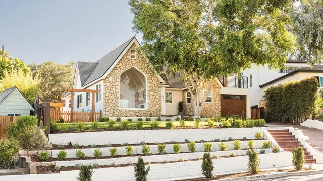 a front view of a house with a yard
