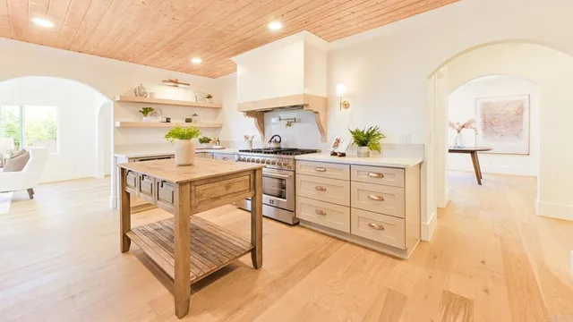 a dining room with furniture and wooden floor