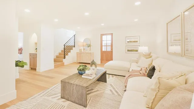 a spacious bathroom with a double vanity sink a mirror and a bathtub