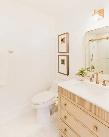 a bathroom with a toilet and shower