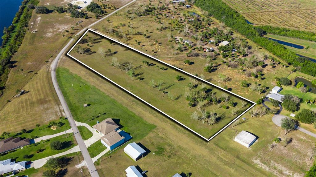 Southwest 144th Parkway Okeechobee, FL 34974 - Photo 20 of 27 an aerial view of a tennis court