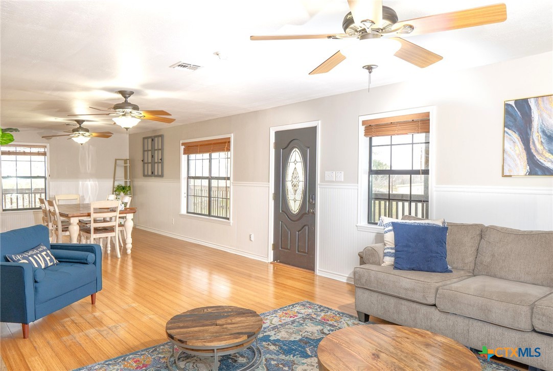 564 Cypress Valley Road Cuero, TX 77954 - Photo 11 of 33 a living room with furniture and a large window
