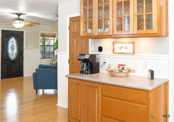 a kitchen with a refrigerator and a sink