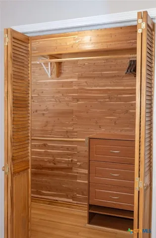 a living room with furniture a rug and a chandelier