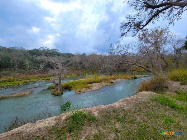 a view of a lake with mountains in the background