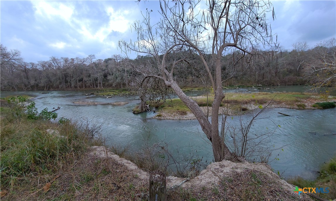 564 Cypress Valley Road Cuero, TX 77954 - Photo 4 of 33 a view of a tree in a yard next to a yard