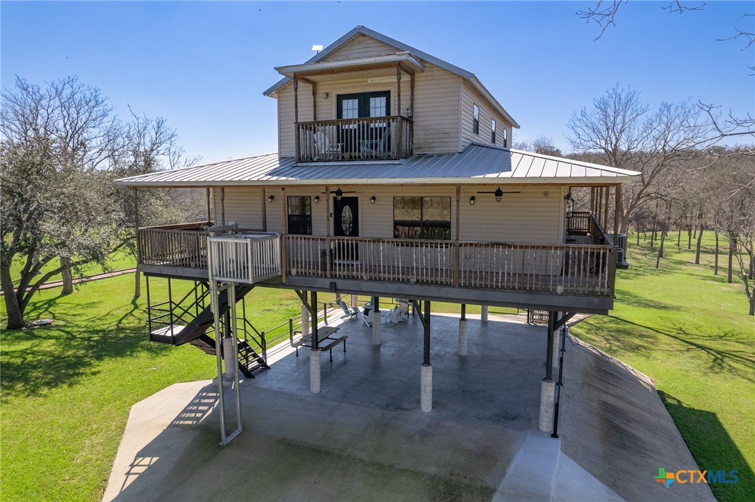 564 Cypress Valley Road Cuero, TX 77954 - Photo 6 of 33 a view of a house with backyard water fountain and sitting area