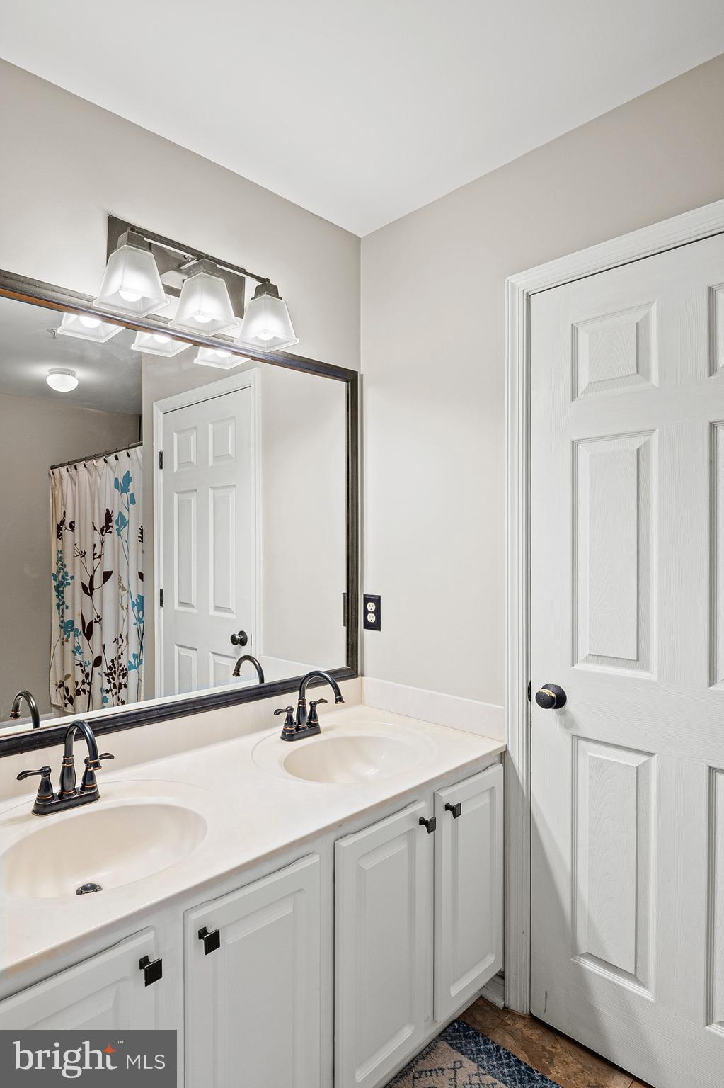222 Gray Fox Court Edgewater, MD 21037 - Photo 17 of 42 a bathroom with double vanity sink and a mirror