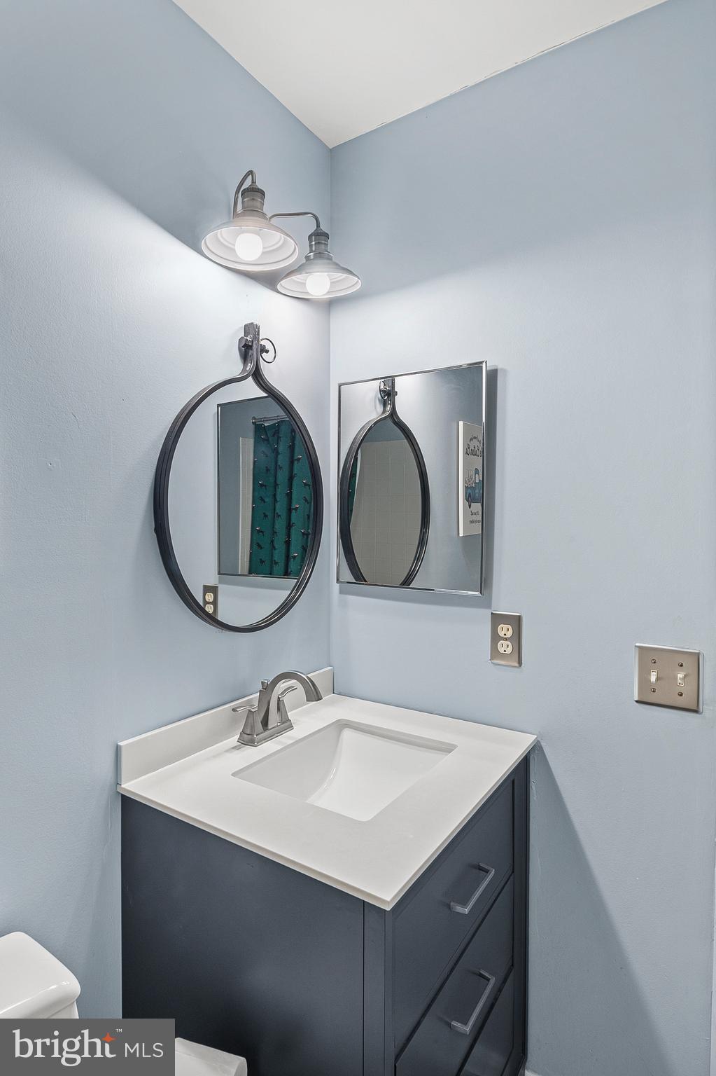 222 Gray Fox Court Edgewater, MD 21037 - Photo 21 of 42 a bathroom with a sink and a mirror