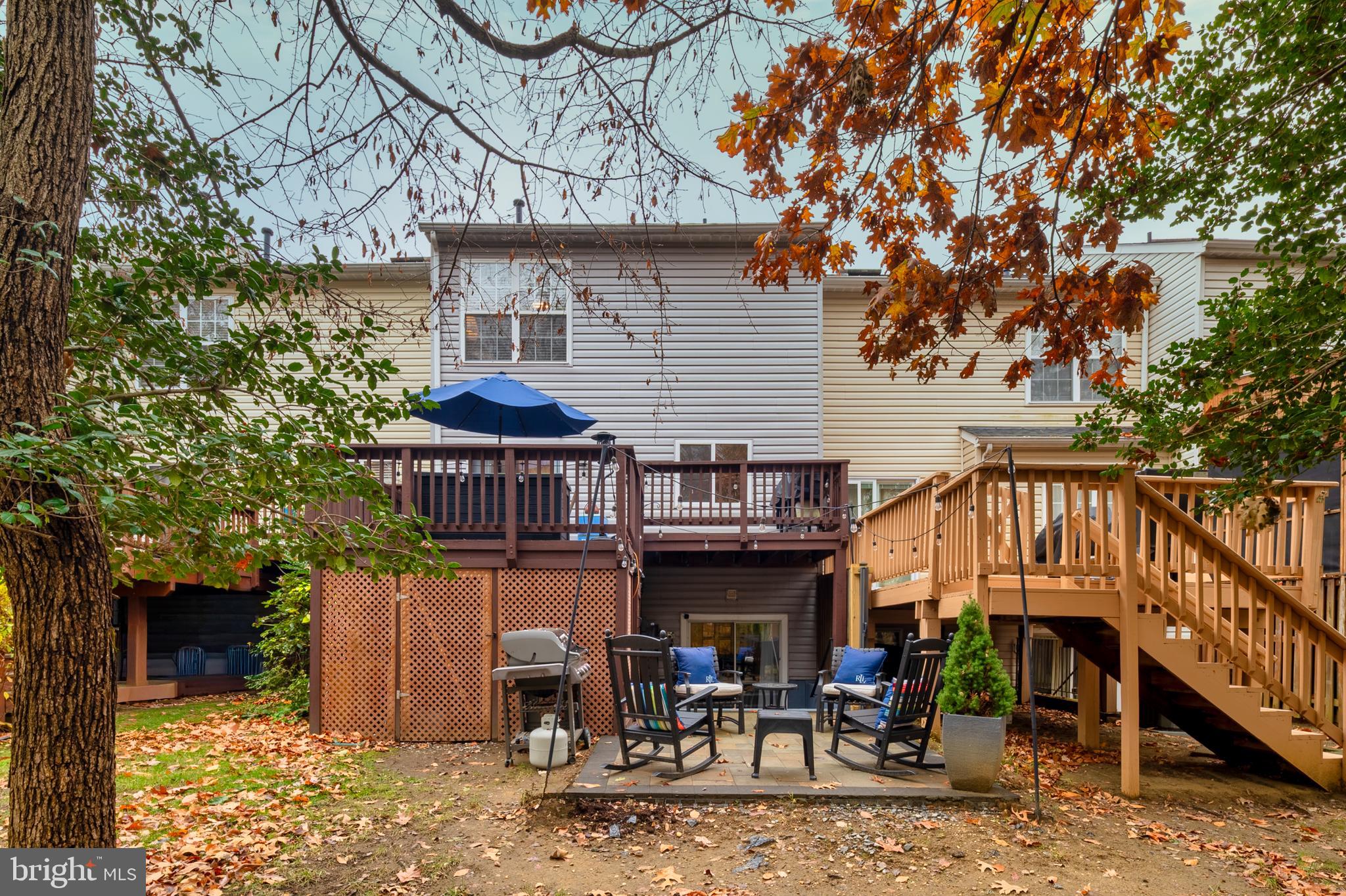 222 Gray Fox Court Edgewater, MD 21037 - Photo 30 of 42 a view of a house with wooden deck and furniture