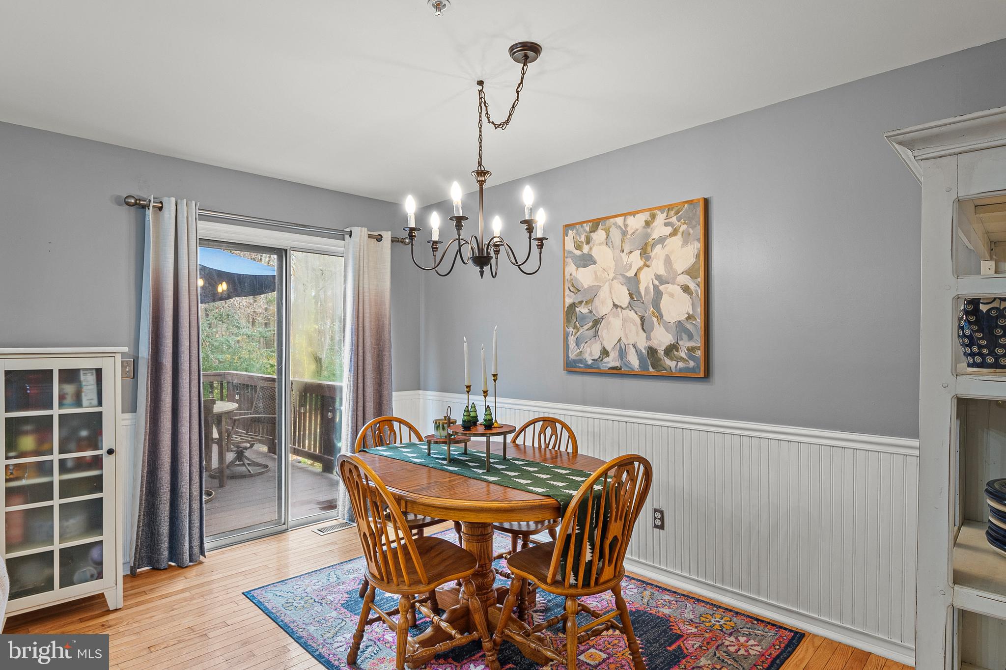 222 Gray Fox Court Edgewater, MD 21037 - Photo 3 of 42 a dining room with furniture a rug and a chandelier