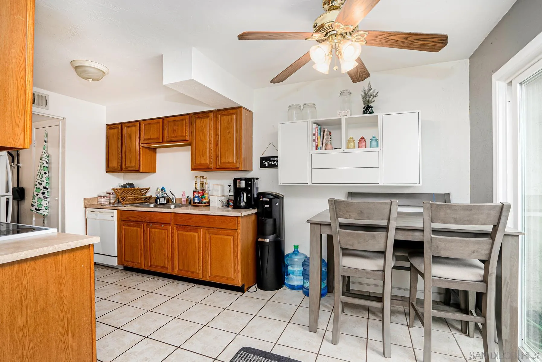 10007 Great Rock Road Santee, CA 92071 - Photo 5 of 26 a kitchen with stainless steel appliances kitchen island granite countertop a sink and cabinets