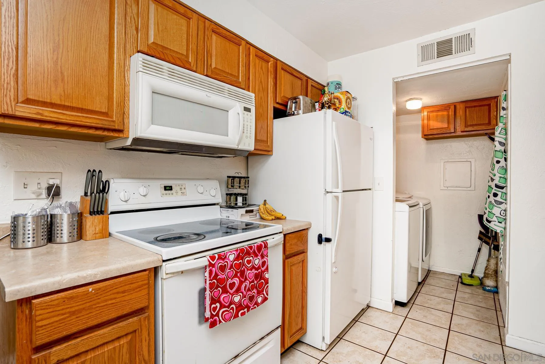 10007 Great Rock Road Santee, CA 92071 - Photo 8 of 26 a kitchen with stainless steel appliances granite countertop a refrigerator and a sink
