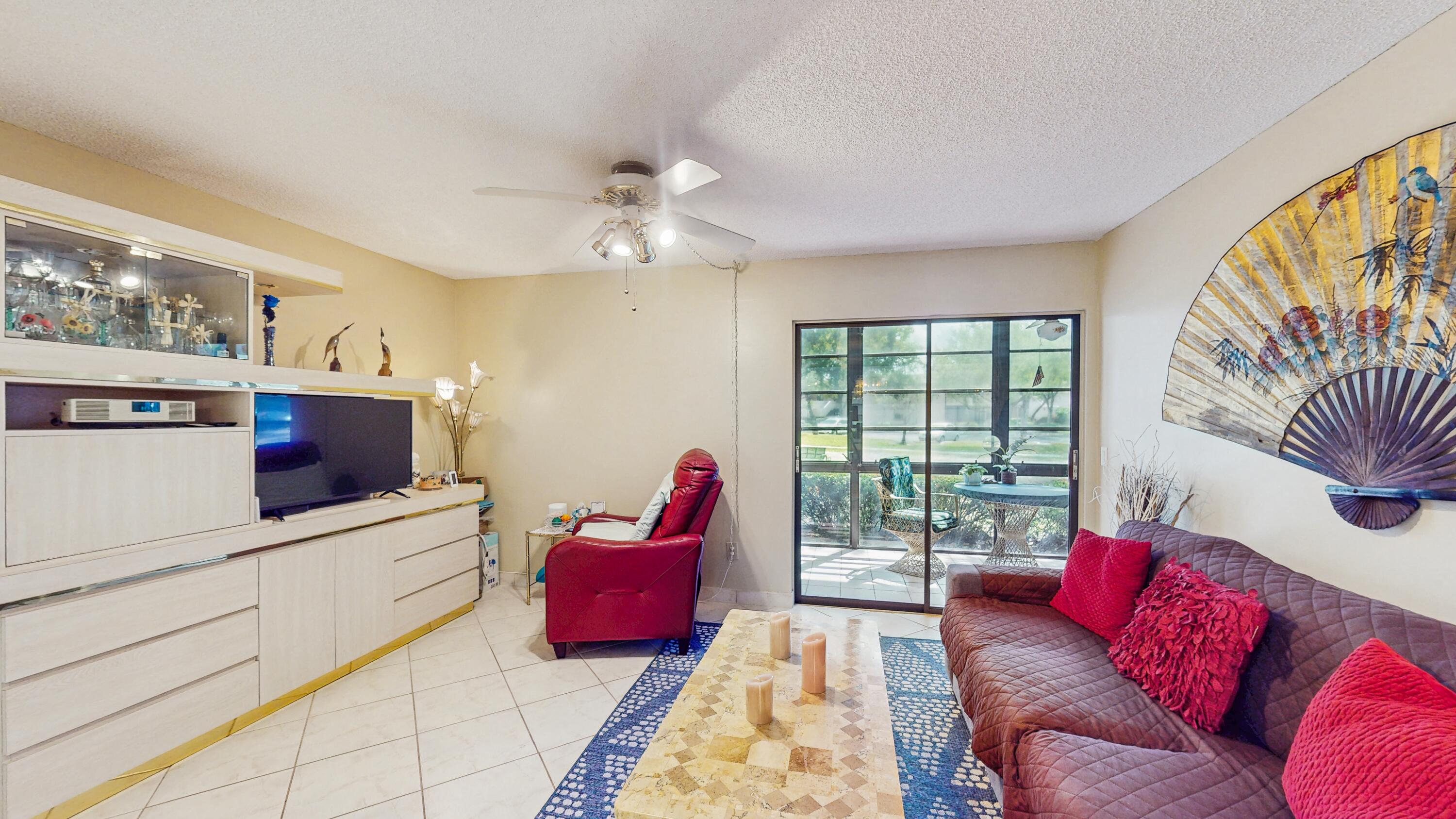 9765 West McNab Road, Unit 115 Tamarac, FL 33321 - Photo 2 of 25 living room side view