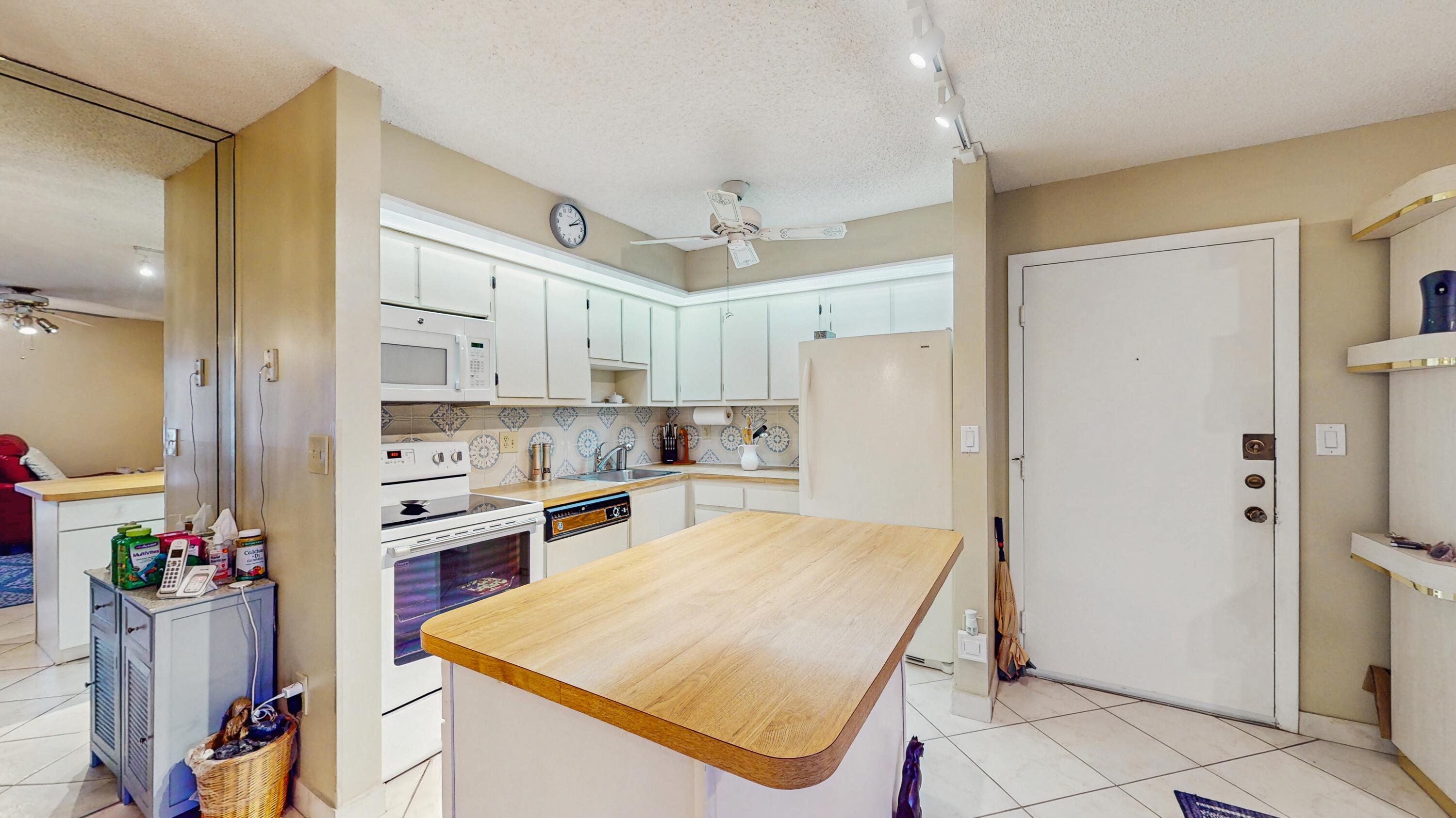 9765 West McNab Road, Unit 115 Tamarac, FL 33321 - Photo 9 of 25 view of kitchen with entrance