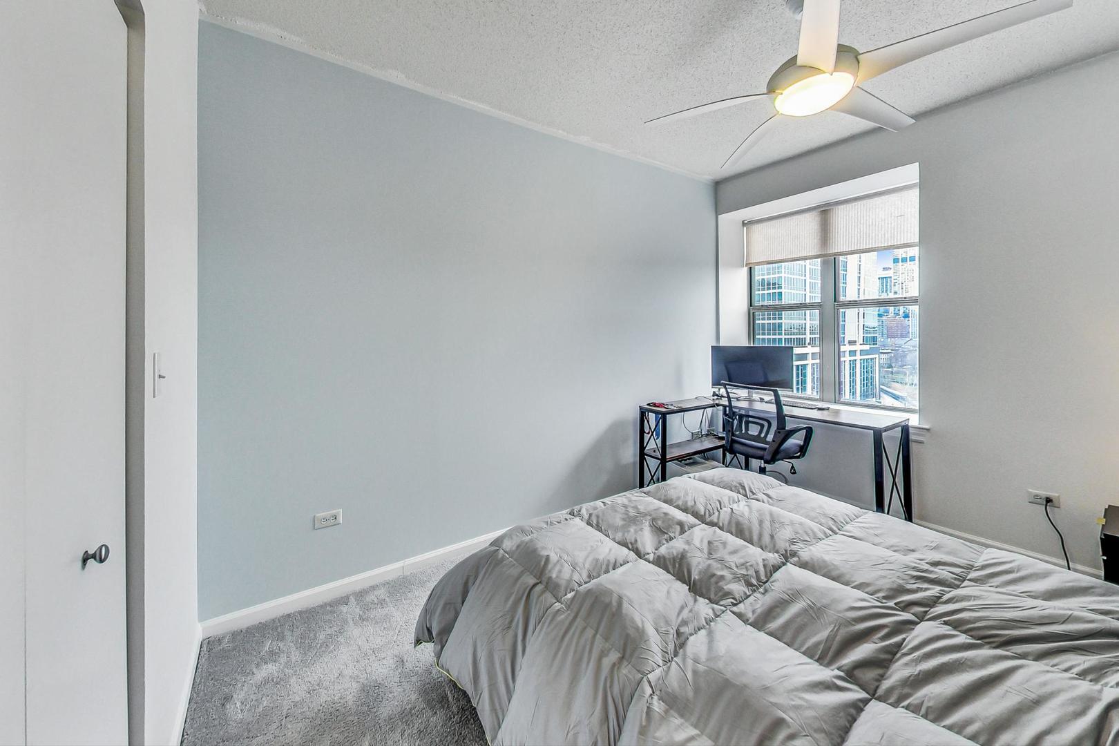 1717 South Prairie Avenue, Unit 802 Chicago, IL 60616 - Photo 12 of 33 a bedroom with a bed and a window