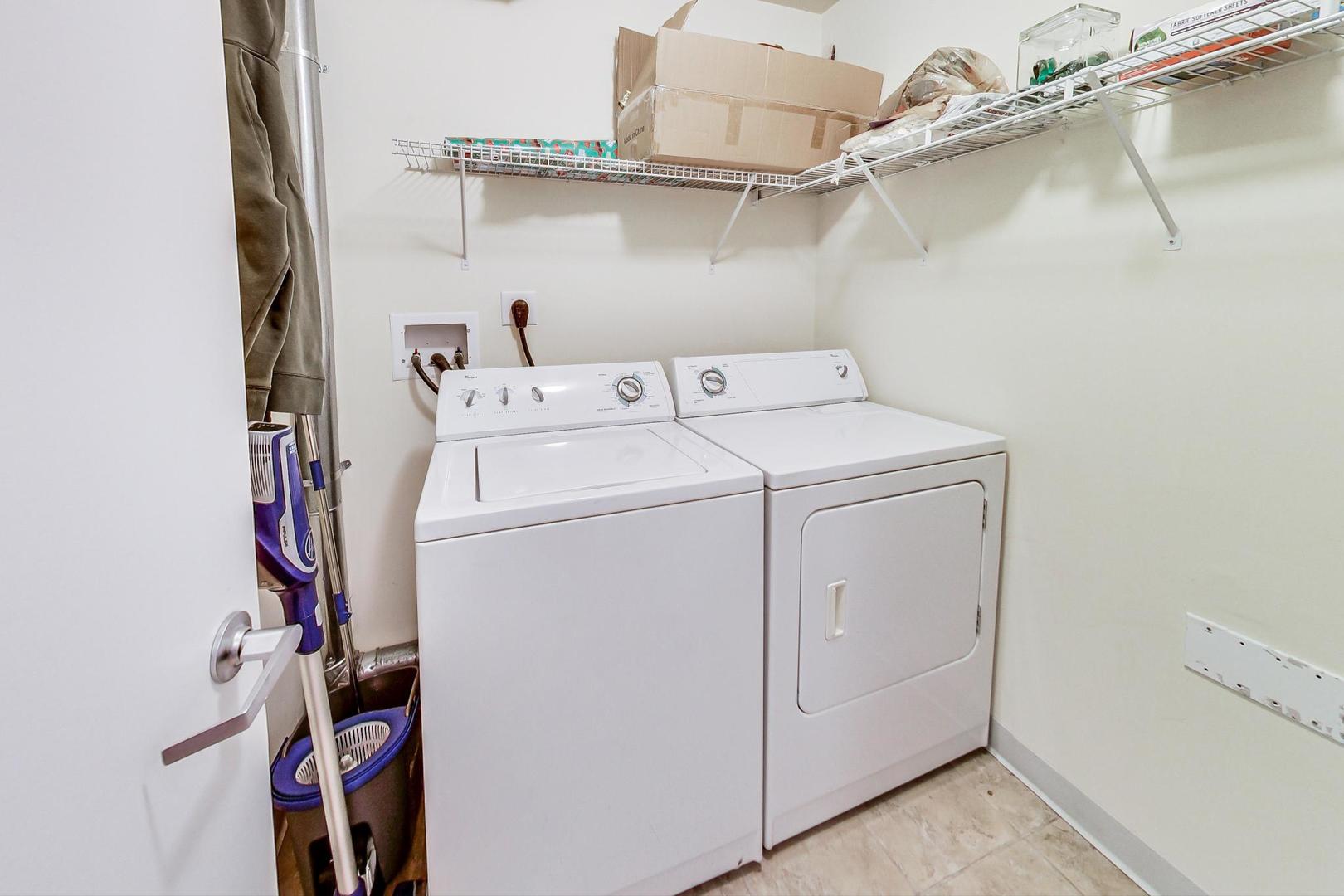 1717 South Prairie Avenue, Unit 802 Chicago, IL 60616 - Photo 16 of 33 a utility room with dryer and washer