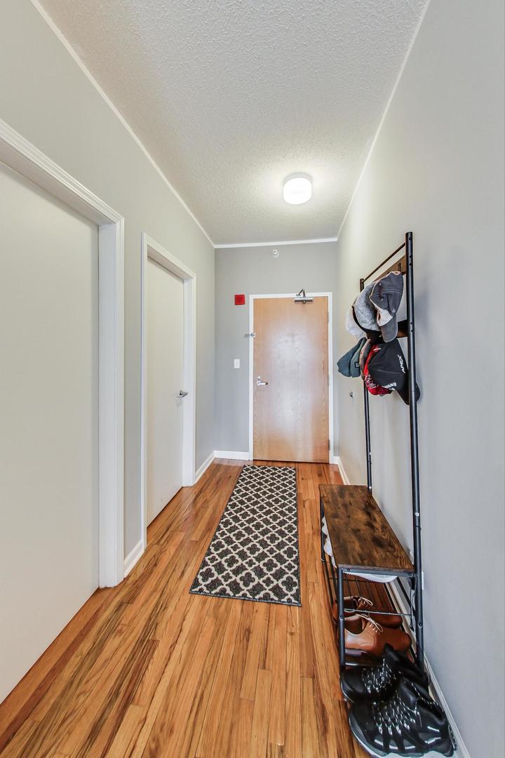1717 South Prairie Avenue, Unit 802 Chicago, IL 60616 - Photo 19 of 33 a bedroom with a bed and a walk in closet