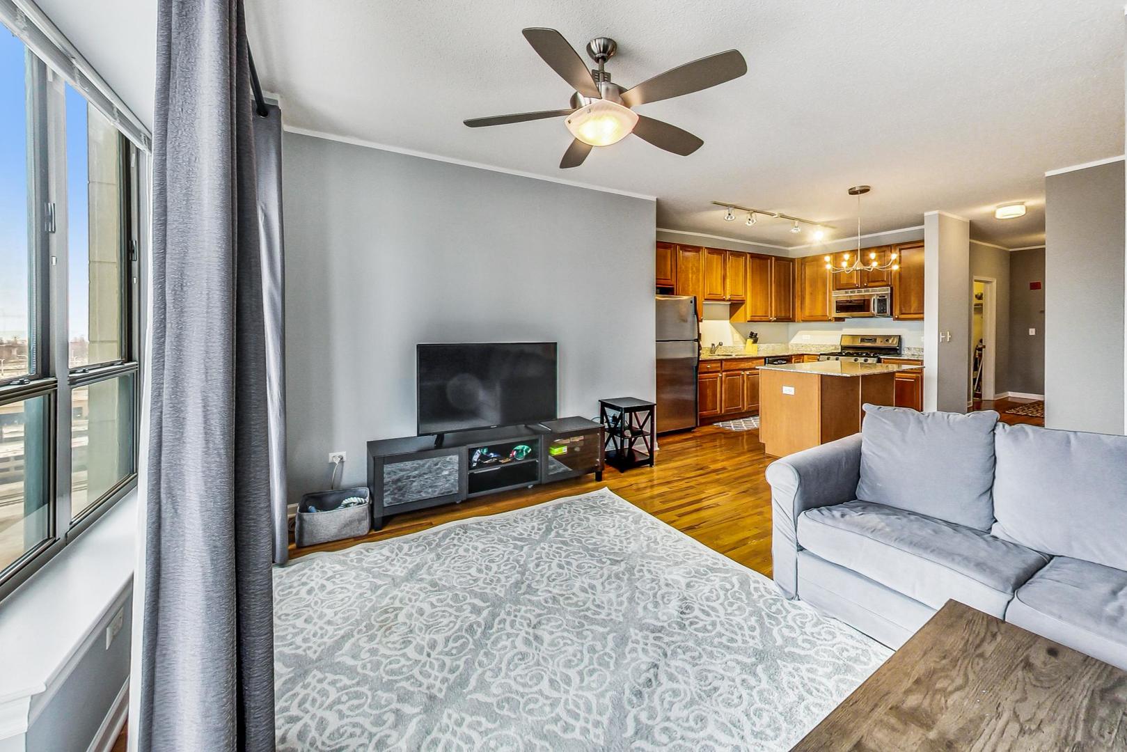 1717 South Prairie Avenue, Unit 802 Chicago, IL 60616 - Photo 4 of 33 a living room with furniture and a flat screen tv
