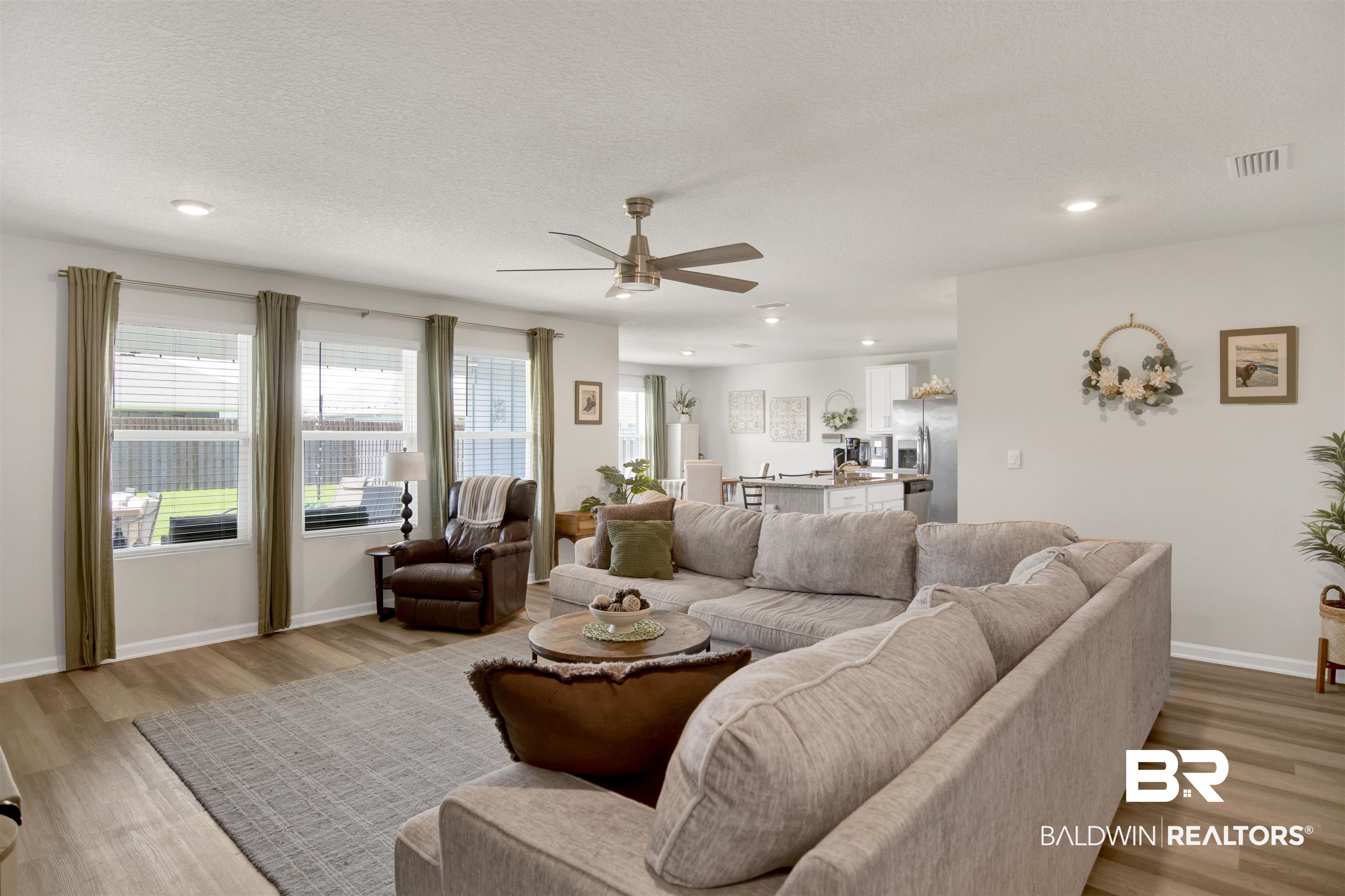 22301 Early Dawn Circle Foley, AL 36535 - Photo 19 of 45 Open concept living space featuring wood-finish flooring, recessed lighting, and a ceiling fan