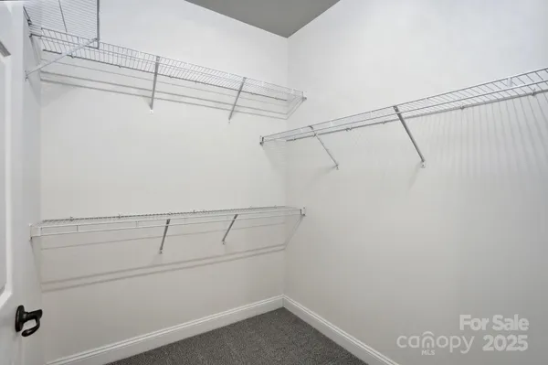 a view of a room with racks on the wall