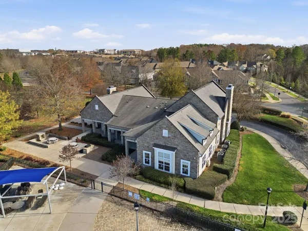 an aerial view of a house with a mountain view