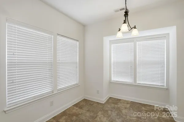a view of a bedroom with windows
