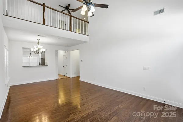 a view of an entryway with wooden floor