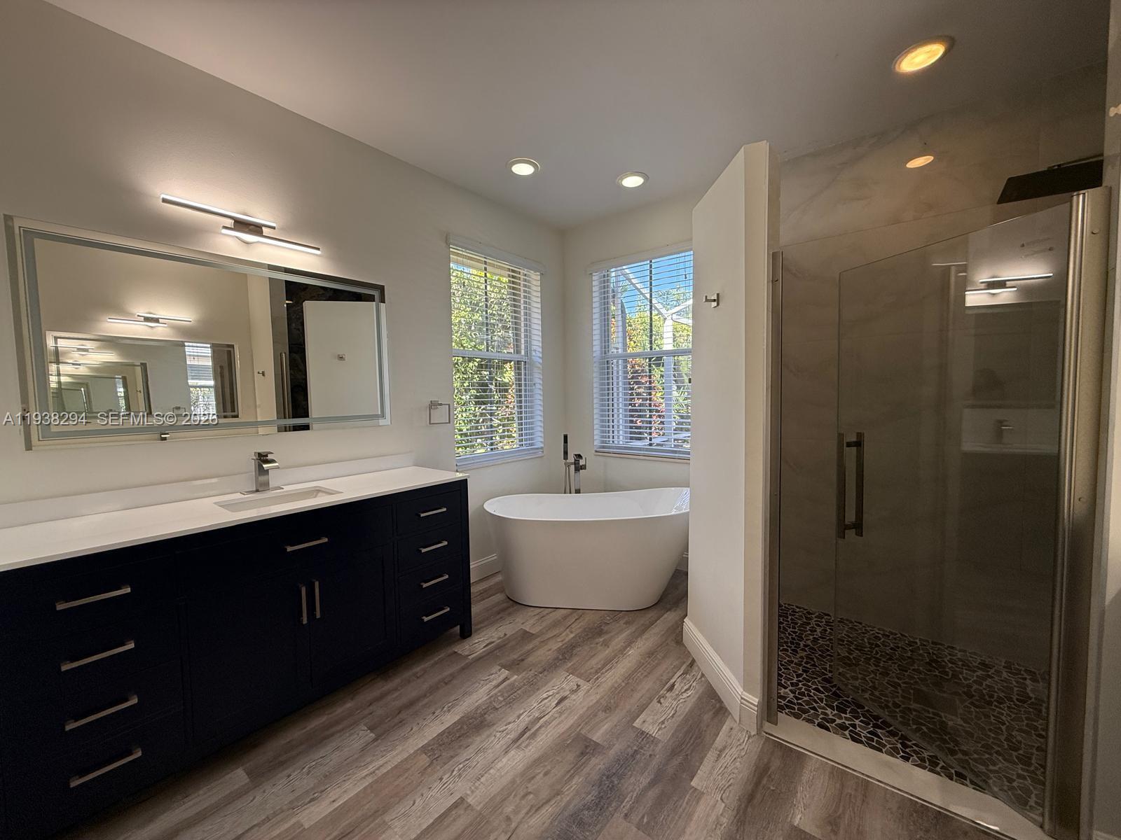2408 Deer Creek Road Weston, FL 33327 - Photo 15 of 30 a bathroom with a double vanity sink mirror and shower