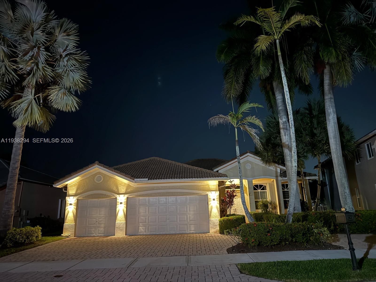 2408 Deer Creek Road Weston, FL 33327 - Photo 3 of 30 a front view of a house