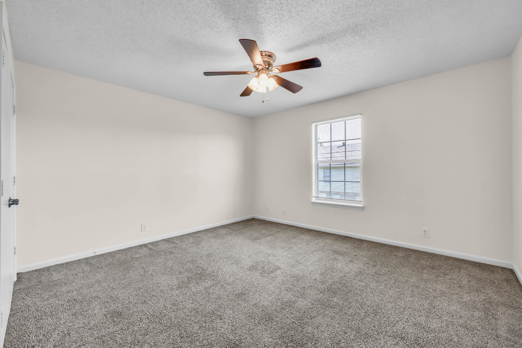 2451 Wilson Road, Unit 6 Clarksville, TN 37043 - Photo 11 of 21 an empty room with windows and ceiling fan