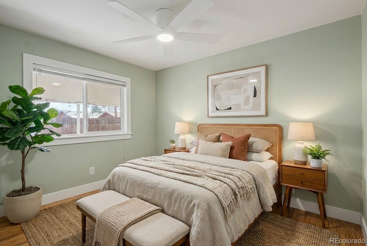 2580 South Perry Street Denver, CO 80219 - Photo 13 of 28 a bedroom with a bed and a potted plant