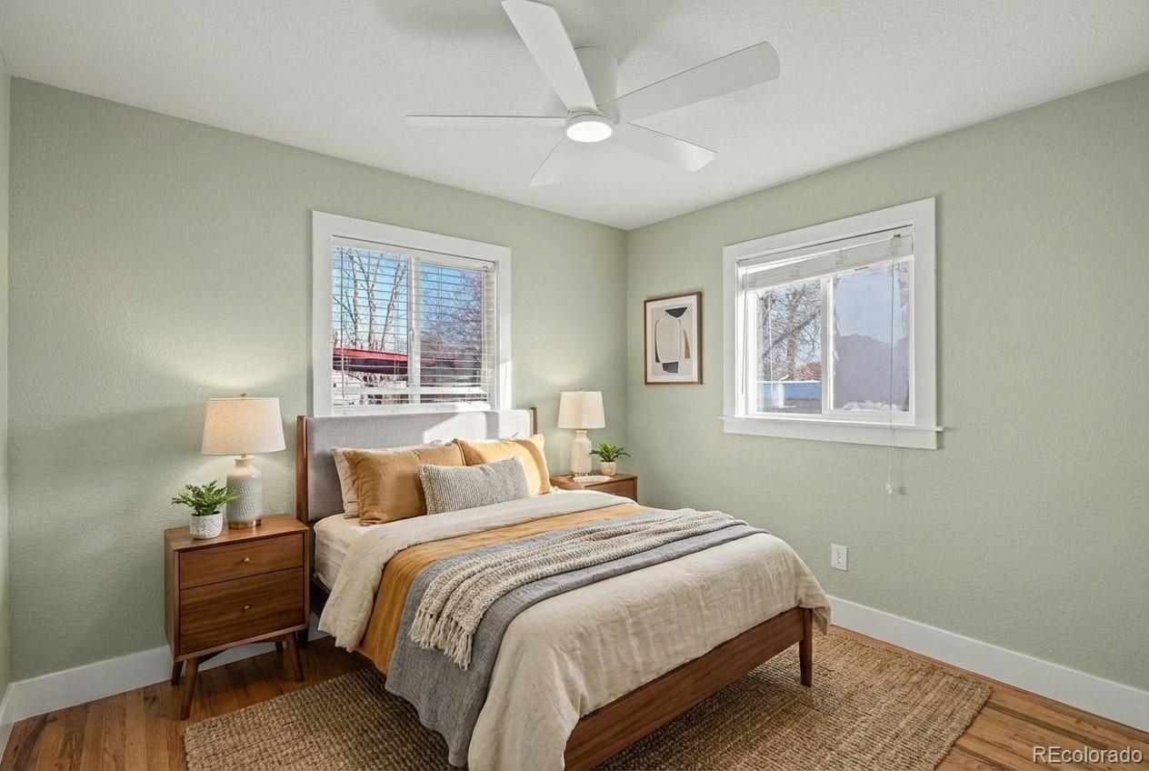 2580 South Perry Street Denver, CO 80219 - Photo 16 of 28 a bedroom with a bed and a window