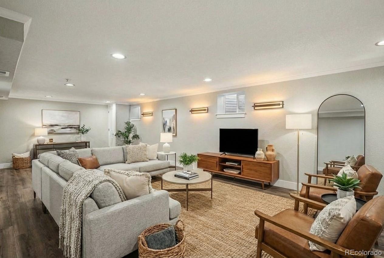 2580 South Perry Street Denver, CO 80219 - Photo 18 of 28 a living room with furniture and a flat screen tv