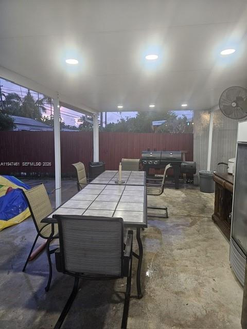8930 Southwest 197th Terrace Cutler Bay, FL 33157 - Photo 9 of 10 a dining room with furniture and a floor to ceiling window