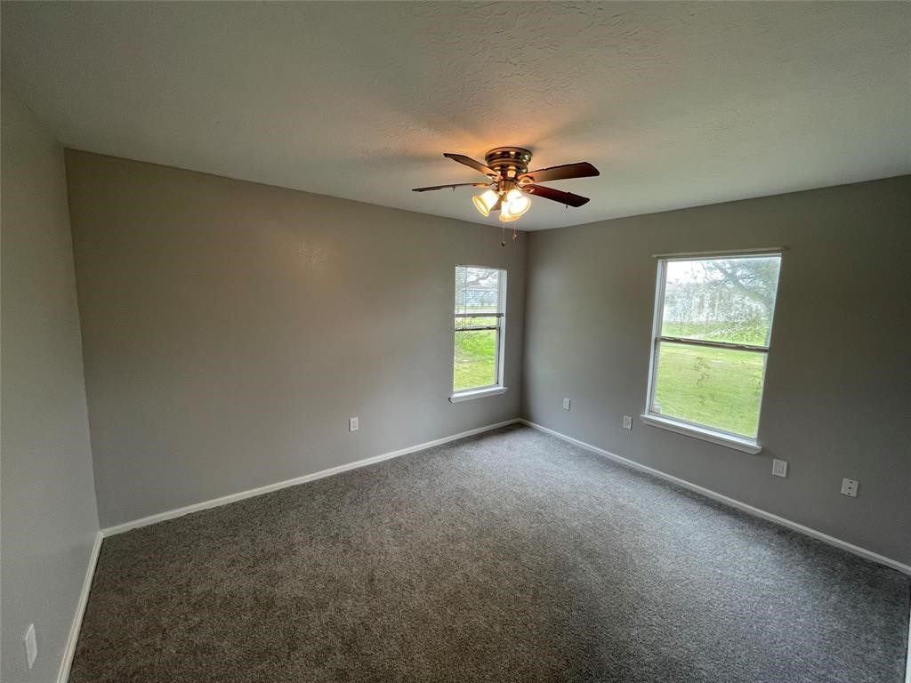 1708 West 5th Street Freeport, TX 77541 - Photo 7 of 9 a view of an empty room with a window